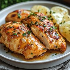 a white plate topped with chicken and potatoes