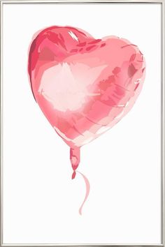 a pink heart shaped balloon floating in the air