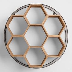 a wooden shelf with hexagonal shelves on it