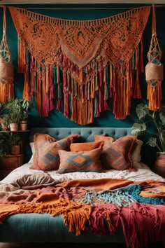 Step into a Bohemian bedroom paradise where vibrant colors and textures invite rest and relaxation. The teal wall cradles a tufted bed adorned with patterned pillows and a multicolored blanket. Above, a crochet tapestry with playful tassels adds vintage charm, contrasting the cool backdrop. Macrame plant holders with lush greenery and a rustic bedside table holding a quaint vase underline the room's nature-inspired theme. This Bohemian retreat is not just a bedroom, it's a sanctuary of comfort Terracotta Bedroom Decor, Bedroom Ideas Terracotta, Terra Cotta Bedroom, Green And Terracotta Bedroom, Bedroom Terracotta, Terracotta Bedroom Ideas, Terracotta Bedroom, Green And Terracotta, Natural Bedroom Decor