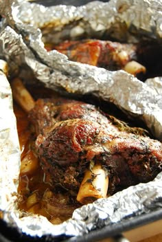 the meat is covered in tin foil and ready to be cooked