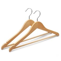 a wooden hanger with two pairs of clothes hanging from it's hooks on a white background