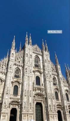 the front view of a large cathedral with many windows