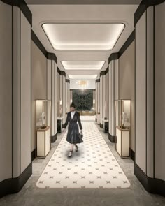 a woman in a black dress walking down a long hallway with white stars on the floor