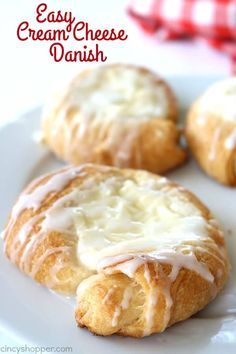 three cream cheese danish biscuits on a white plate