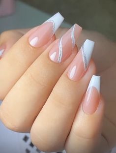 a woman's hand with some pink and white nails