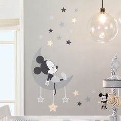 mickey mouse on the moon wall sticker in a child's room with stars