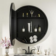 a bathroom sink with lots of different items on it's shelf above the sink