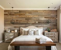 a bedroom with wood paneled walls and white bedding, along with two nightstands