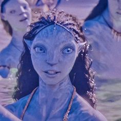 an alien woman is standing in the water with two other people behind her looking at the camera