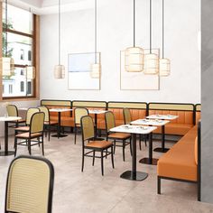 an empty restaurant with tables and chairs in front of large windows, along with hanging lights