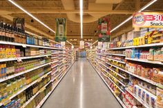 an aisle in a grocery store filled with lots of different types of food and drinks