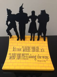 there is a yellow sign with some silhouettes on it that says it's not where you go, it's who you meet along the way