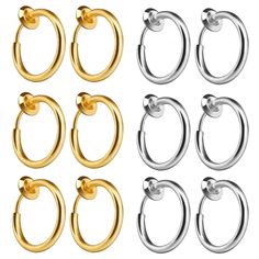 six pairs of gold and silver metal hoop earrings with round nose rings, set of 6