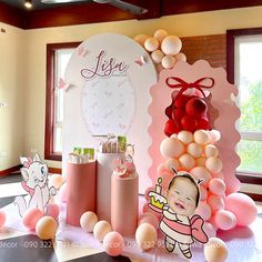 a baby shower party with balloons and decorations