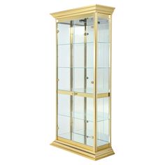 a tall display case with glass doors and gold trim