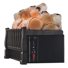 a pile of logs sitting on top of a toaster oven with it's lights on