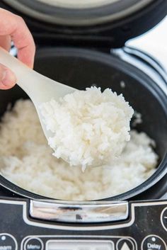 someone is spooning rice out of an instant pot