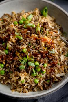 a white bowl filled with rice and vegetables