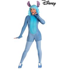 a woman dressed in a blue costume talking on a cell phone while wearing bunny ears