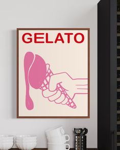 there is a poster on the wall that says gelato with a hand holding a scoop of ice cream