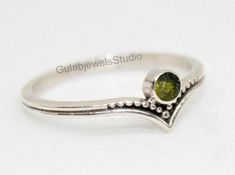 Ring Details- Stone- Natural Moldavite from Czech Republic Metal- 925 Sterling Silver ♥ What is Moldavite? Moldavite is a mysterious green glass stone, classed in the tektite family and found only in the Czech Republic. An ancient meteorite impact occurred on our planet about 15 million years ago, which gave birth to a gemstone with many legends, myths, and secrets. ♥ Benefits of Moldavite? Moldavite is a mystical stone that promotes spiritual transformation. It's known for its unique ability to immediately open a portal to the divine. Said to be a stone of metaphysical healing, Moldavite brings about elevated energy levels and inner peace. In recent years, the Internet has exploded with cheap and completely fake Moldavite. The market for this mysterious gem that is increasingly difficult Moldavite Ring, Meteorite Ring, Spiritual Transformation, Metaphysical Healing, Ring Unique, Green Glass, Rings Statement, Unique Rings, V Shape