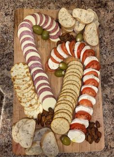 a wooden cutting board topped with different types of food