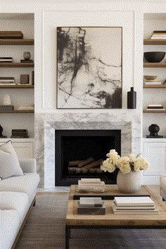 a living room filled with furniture and a fire place in front of a painting on the wall