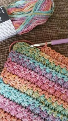 a crochet bag with yarn next to it