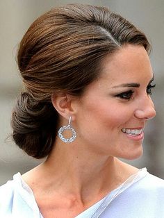 the duke and princess of cambridge smile as they walk together