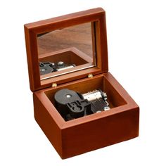 an open wooden box with two cameras inside