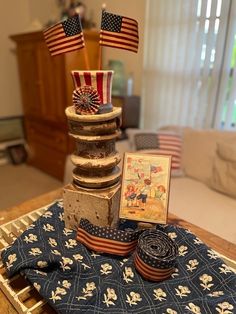 an american flag themed cake on a table in a living room with other decorations and decor