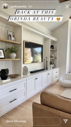 a living room filled with furniture and a flat screen tv on top of a wall