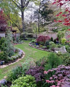 a garden with lots of flowers and trees