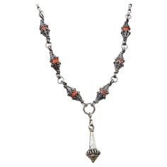 This unique one of a kind vintage necklace comes from North India or Afghanistan, composed of handmade elements that hug Coral Beads. The Centre Piece is a cone , bell shaped element, Made in Acid Tested coin Silver (.800) 25 inches long 55 cm The length can be adjusted on demand North India, Centre Piece, Coral Beads, Centre Pieces, Vintage Necklace, Vintage Silver, Jewelry Necklace Pendant, Coral, Jewelry Necklaces