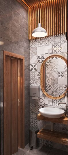 a bathroom with a sink, mirror and wooden cabinet in it's corner next to the toilet