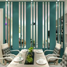 a dining room with chairs and a table in front of a striped wall that has vertical stripes on it