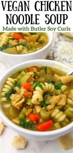 two white bowls filled with chicken noodle soup