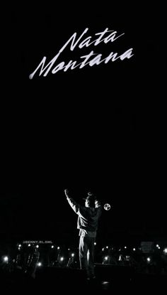 a man standing on top of a field holding a tennis racquet