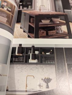 an open book with pictures of kitchen furniture and accessories in it's center section