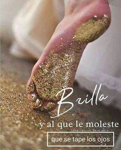 a person's foot with gold glitter on it and the words bailla written in spanish