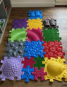 colorful puzzle pieces laid out on the floor