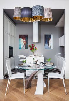 a dining room table with four chairs around it