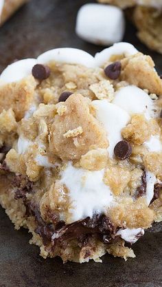 an oatmeal cookie with chocolate chips and marshmallows on top