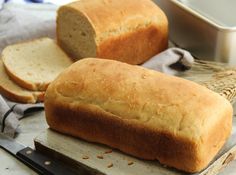 a loaf of bread sitting on top of a cutting board