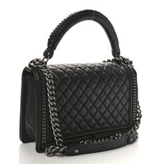 This is an authentic CHANEL Goatskin Quilted New Medium Boy Top Handle Flap in Black. This chic shoulder bag is crafted of diamond quilted goatskin leather in black, with aged silver chain links woven into the linear-quilted border. The bag features a sturdy rolled leather top handle with a matching woven detail, and an aged silver chain link shoulder strap with a leather shoulder pad. The crossover flap opens with a boy CC press lock to a black fabric interior with a patch pocket. Chanel Boy Bag Black, Chanel Print, Chanel Crossbody, Chanel Tweed, Denim Quilt, Quilted Wallet, Chanel Shoulder Bag, Chain Links, Diamond Quilt