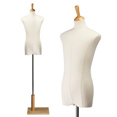 two white mannequins on wooden stands