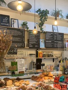 the inside of a bakery with donuts on display