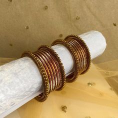 Two regal small maroon and gold bangle set for both arms.  Ready to ship 📦 Rose Gold Metal Bangle For Wedding, Adjustable Metal Bangle For Celebration, Gold Bracelets For Festive Party, Traditional Brown Bangle Jewelry, Gold Bracelets For Festive Party Occasions, Rose Gold Round Bracelets For Festive Occasion, Rose Gold Round Bracelet For Festive Occasion, Festive Gold Metal Bangle, Elegant Gold Copper Cuff Bracelet