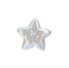 a silver star shaped object on a white background